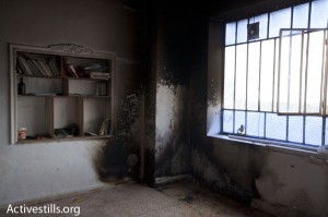 Demonstration in Nabi salih, Palestine, 22/10/2010. Terbakar: Salah satu rumah warga desa Nabi Saleh yang terbakar karena ditembaki dengan selongsong gas airmata oleh tentara Israel. Foto: Activestills